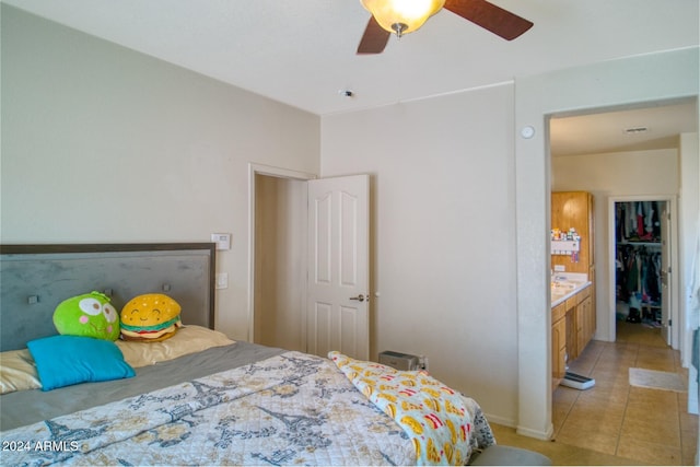 tiled bedroom with ceiling fan