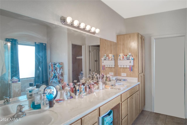 bathroom with vanity, toilet, and tile patterned flooring