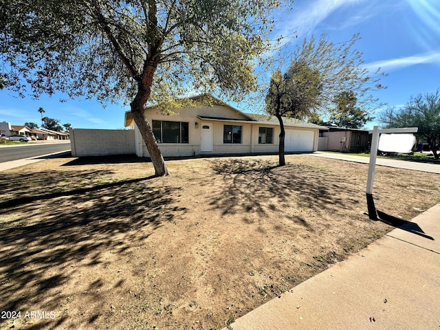 single story home featuring a garage