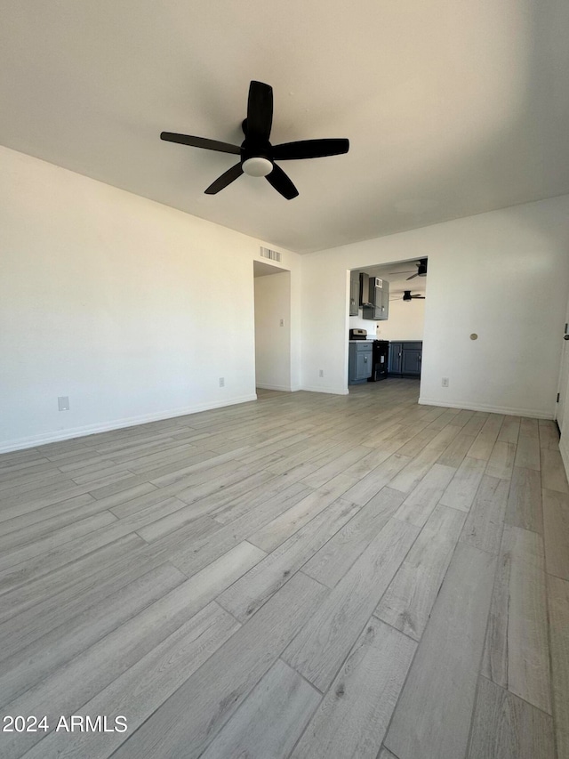 interior space featuring light hardwood / wood-style flooring and ceiling fan