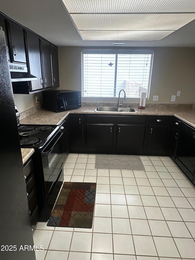 kitchen featuring extractor fan, a wealth of natural light, sink, light tile patterned floors, and black appliances