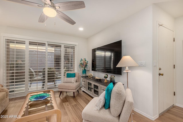 sitting room featuring light hardwood / wood-style floors and ceiling fan