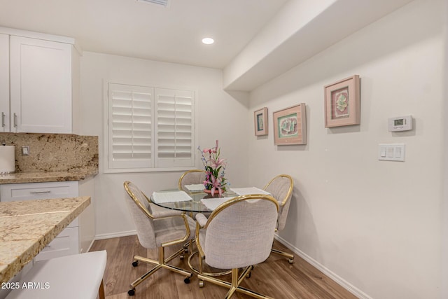 dining room featuring light hardwood / wood-style floors