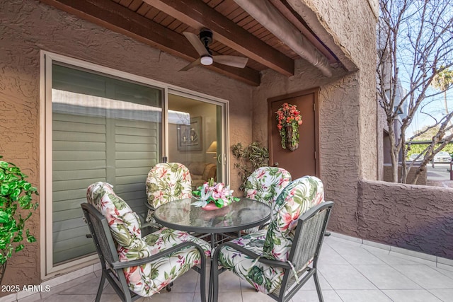 view of patio featuring ceiling fan