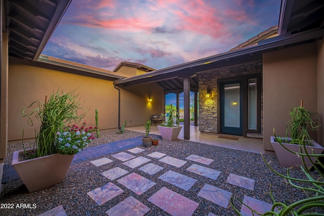 view of patio terrace at dusk