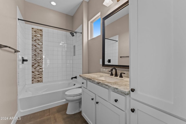 full bathroom featuring vanity, toilet, and tiled shower / bath