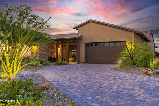 mediterranean / spanish house featuring a garage