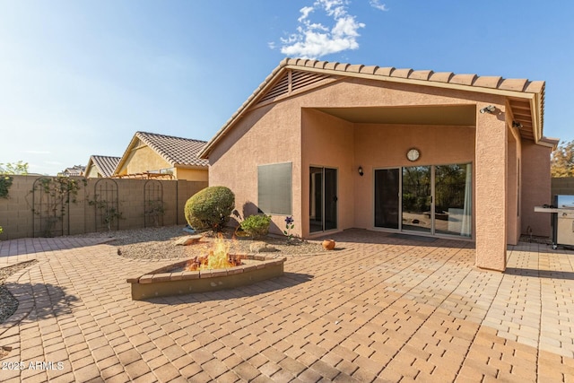 back of house featuring a patio area