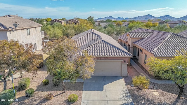 birds eye view of property featuring a mountain view