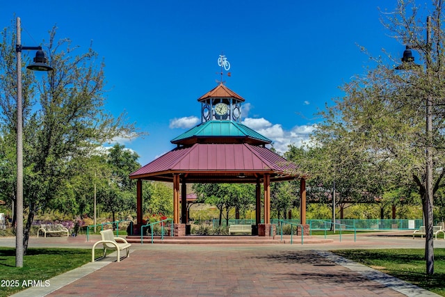 surrounding community with a gazebo and tennis court