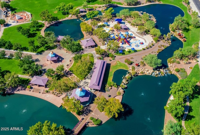 birds eye view of property with a water view