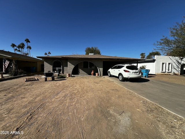 ranch-style home featuring a carport