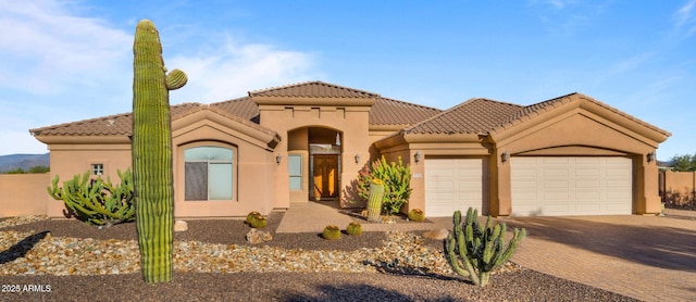 28309 N 156th Way, Scottsdale, AZ 85262 - mediterranean / spanish home with an attached garage, stucco siding, decorative driveway, and a tile roof