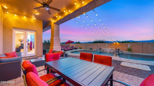 28309 N 156th Way, Scottsdale, AZ 85262 - patio terrace at dusk featuring a fenced backyard, outdoor dining space, a patio, and a ceiling fan