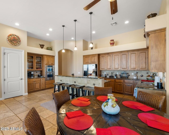 28309 N 156th Way, Scottsdale, AZ 85262 - dining room featuring arched walkways, a ceiling fan, and recessed lighting