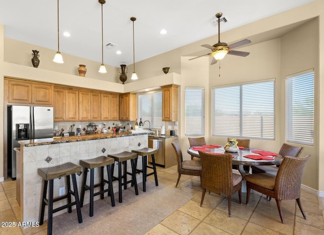 28309 N 156th Way, Scottsdale, AZ 85262 - dining area featuring a ceiling fan, a towering ceiling, recessed lighting, and baseboards