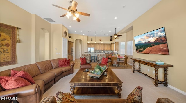 28309 N 156th Way, Scottsdale, AZ 85262 - living room featuring a ceiling fan, arched walkways, baseboards, and light carpet