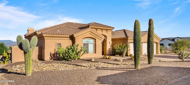 28309 N 156th Way, Scottsdale, AZ 85262 - mediterranean / spanish-style home with concrete driveway, an attached garage, stucco siding, and a tiled roof