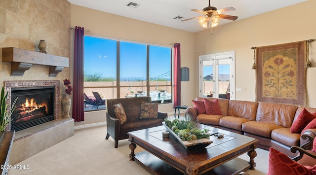 28309 N 156th Way, Scottsdale, AZ 85262 - living area featuring ceiling fan, a tiled fireplace, and light carpet