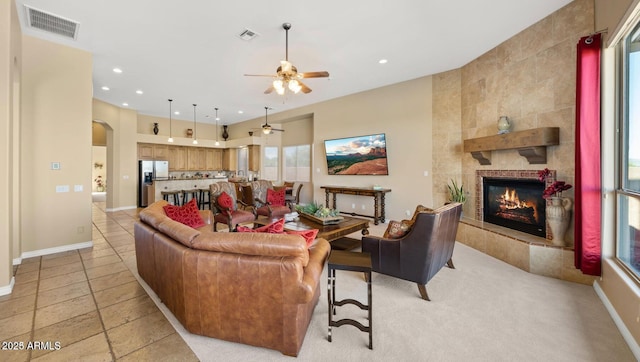 28309 N 156th Way, Scottsdale, AZ 85262 - living room featuring arched walkways, a fireplace, a ceiling fan, recessed lighting, and baseboards