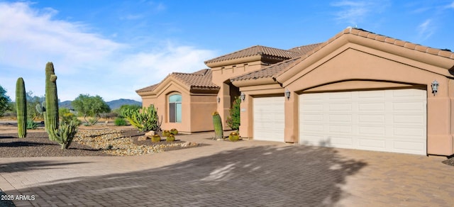 28309 N 156th Way, Scottsdale, AZ 85262 - mediterranean / spanish house featuring decorative driveway, a tile roof, a garage, and stucco siding