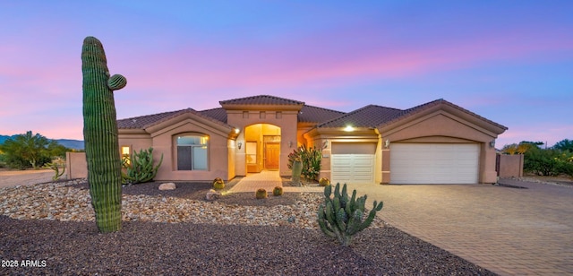 28309 N 156th Way, Scottsdale, AZ 85262 - mediterranean / spanish home with an attached garage, a tile roof, driveway, and stucco siding