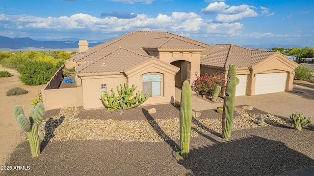 28309 N 156th Way, Scottsdale, AZ 85262 - mediterranean / spanish house featuring driveway, a garage, a tiled roof, and stucco siding