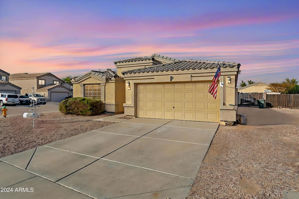 view of front of property with a garage