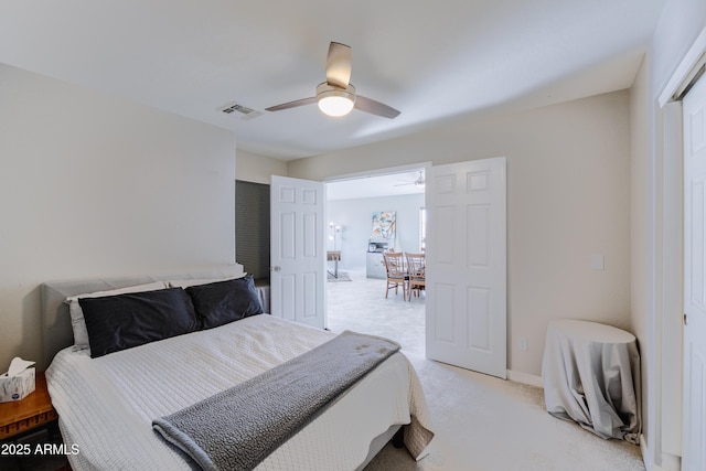 bedroom featuring light carpet and ceiling fan