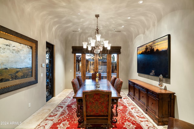 dining space with a notable chandelier