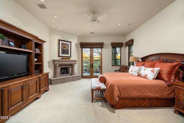 carpeted bedroom with ceiling fan and access to exterior