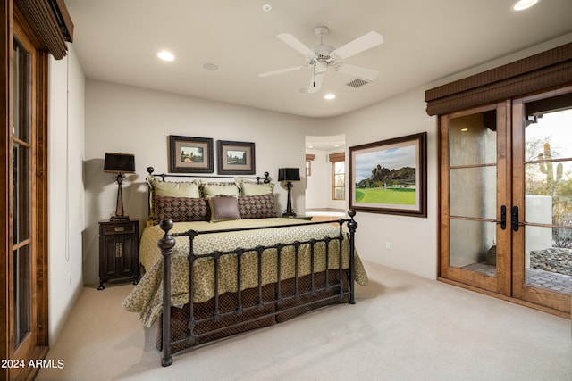 carpeted bedroom with access to outside, ceiling fan, and french doors