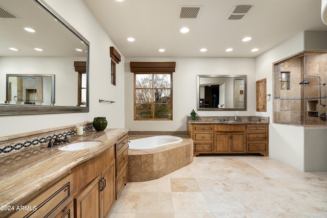 bathroom with vanity and plus walk in shower