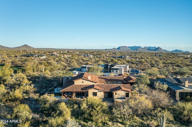 birds eye view of property with a mountain view