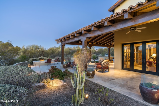 view of patio featuring ceiling fan and french doors