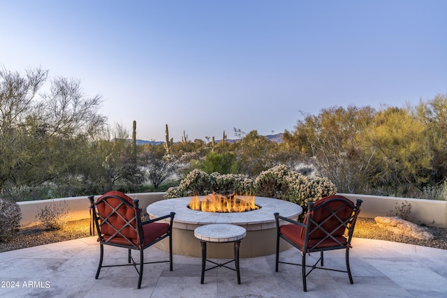 view of patio / terrace with an outdoor fire pit