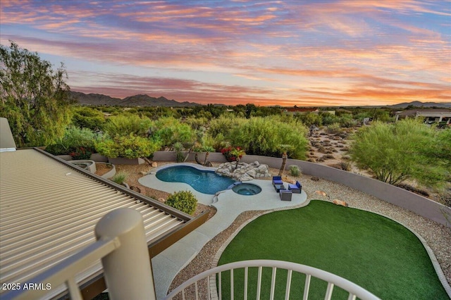 view of swimming pool with a fenced in pool, a fenced backyard, a patio area, a mountain view, and an in ground hot tub