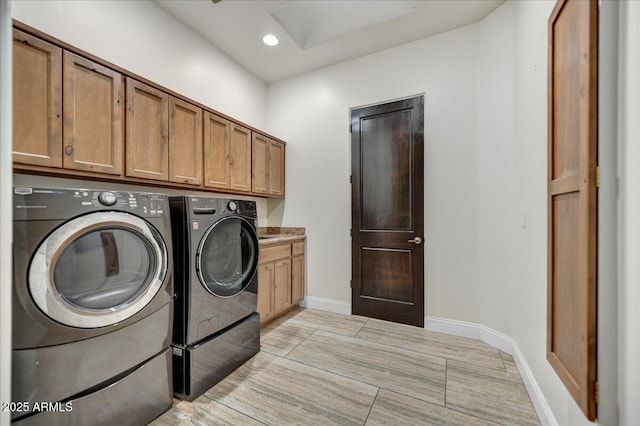 laundry area featuring cabinet space, recessed lighting, independent washer and dryer, and baseboards