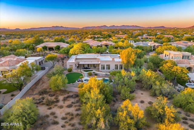 birds eye view of property with a mountain view