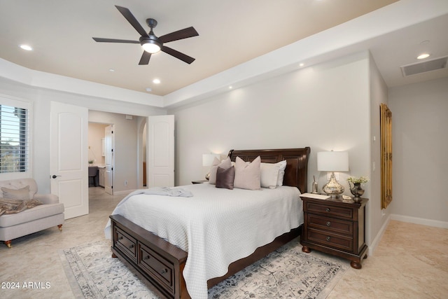 bedroom with ceiling fan and connected bathroom