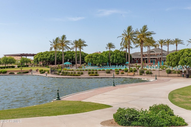 surrounding community featuring a water view