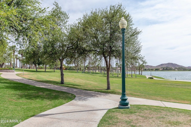 view of home's community featuring a yard and a water and mountain view