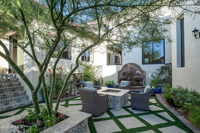 view of patio / terrace with a fire pit