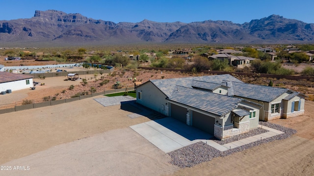 birds eye view of property with a mountain view