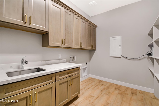 laundry area featuring hookup for a washing machine, cabinet space, light wood-style floors, electric dryer hookup, and baseboards