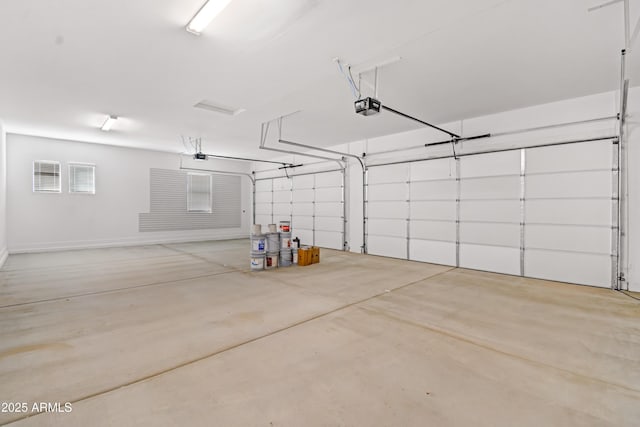 garage featuring a garage door opener