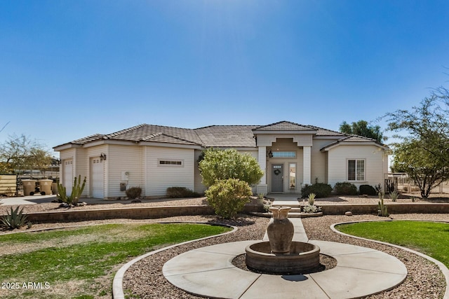 mediterranean / spanish-style home featuring a garage