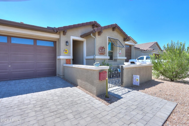 view of front of home with a garage