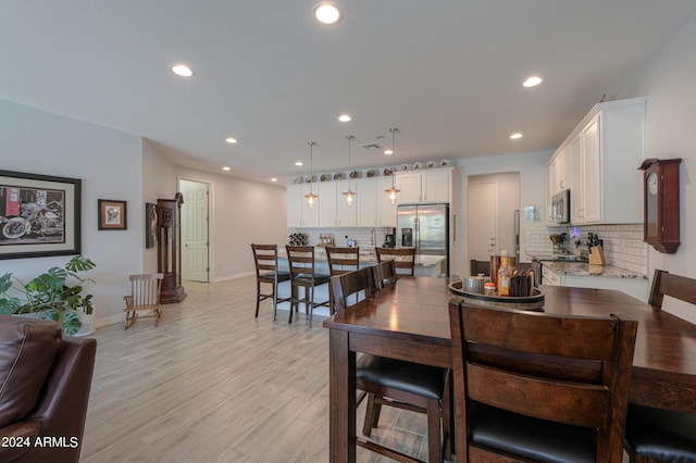 dining area with light hardwood / wood-style flooring