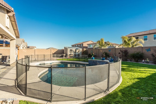 view of swimming pool featuring a lawn